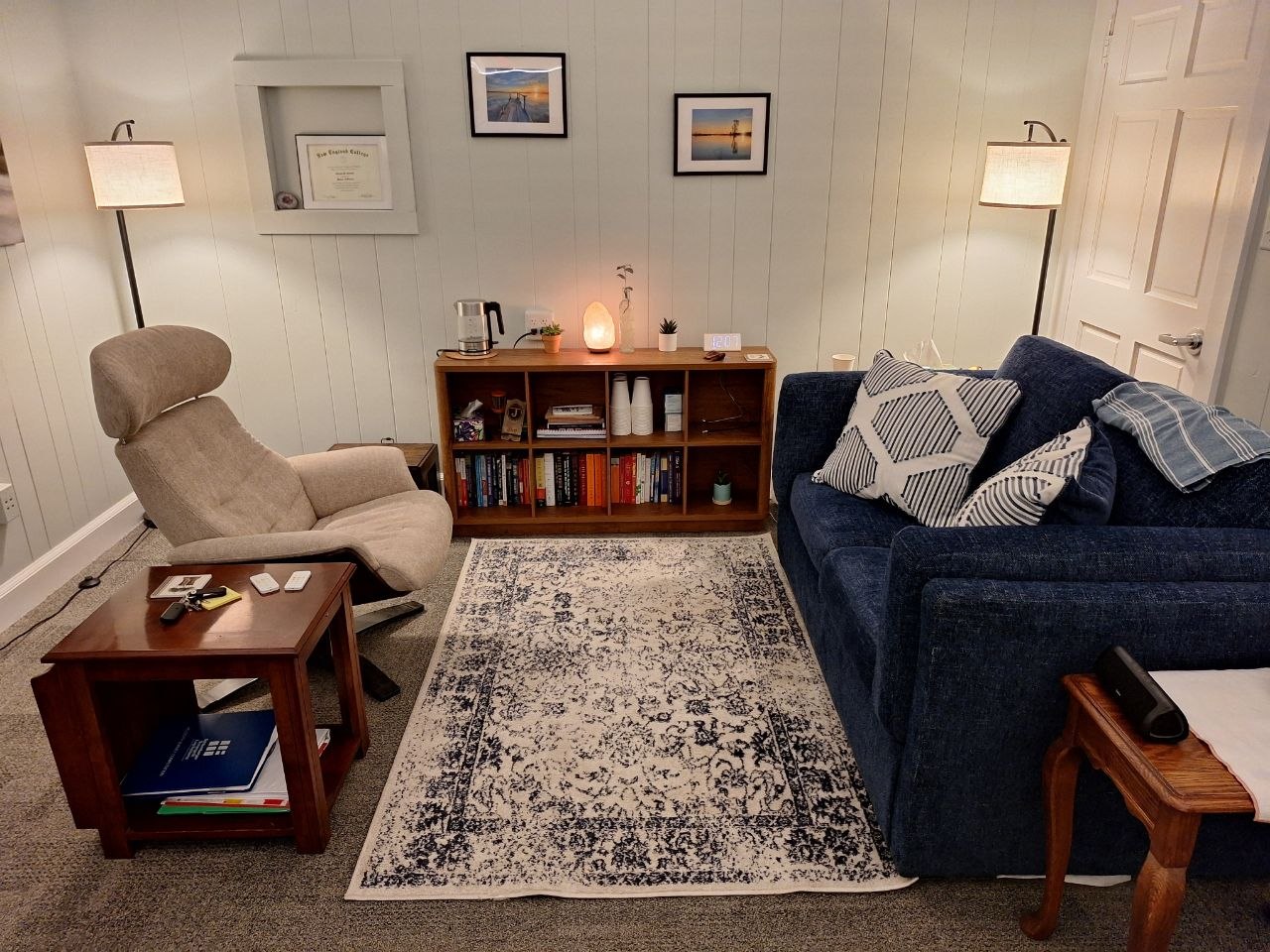 Therapy office at Covered Bridge Counseling in Pepperell, MA, with comfortable seating and warm lamp lighting for individual and couples counseling sessions.